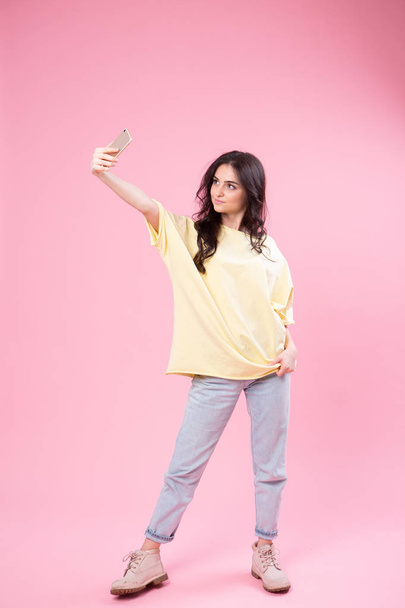 Life stream video selfie mania! Studio photo portrait of attractive cheerful fun joy joyful girl making taking self picture posing for camera isolated pastel background copy space - Foto, Imagem