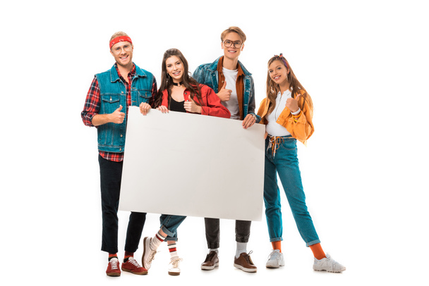 stylish hipster friends showing thumbs up and holding blank banner isolated on white - Zdjęcie, obraz