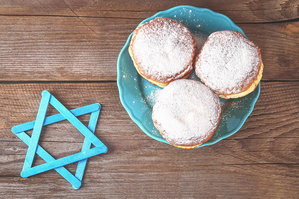 Jewish holiday Hanukkah and its attributes, menorah, donuts, Star of David. Hanukkah menorah. Hanukkah holiday. Jewish Hanukkah - Φωτογραφία, εικόνα