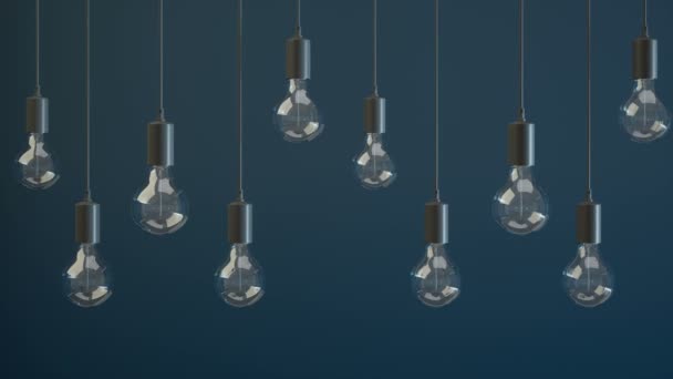 Light bulb lamps on a blue background - Video, Çekim