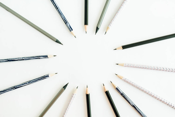 Round frame of pencils on white background. Flat lay, top view. - Fotoğraf, Görsel