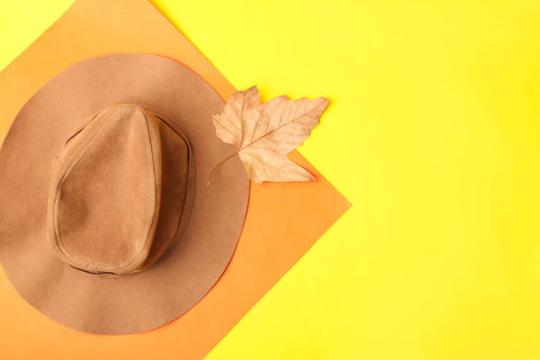 Brown women's hat on yellow background.  Top view. - Foto, Imagem