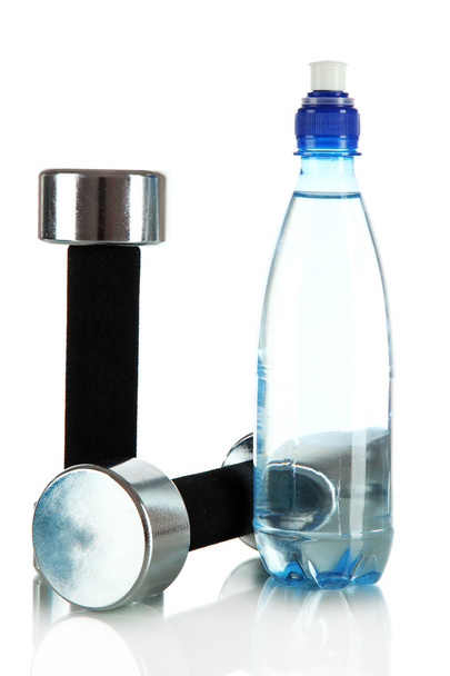 Dumbbells with bottle of water isolated on white - Photo, image
