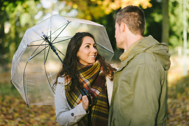 Cute couple of lovers in autumn outdoor. Love and caring relationship concep. - Foto, Imagen