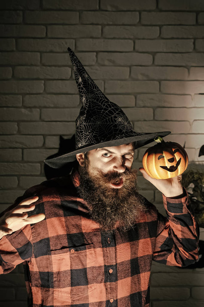 Halloween man with pumpkin in darkness - Photo, Image