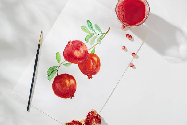 Tropical summer concept made of pomegranate fruit and hand drawing illustration. - Photo, Image