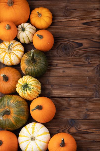 Many orange pumpkins on wooden background , Halloween concept , top view with copy space - Zdjęcie, obraz