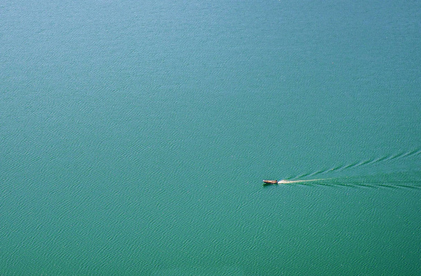 Small boat in a huge lake of the town of Nemi. The surroundings of Rome. Italy - Photo, Image