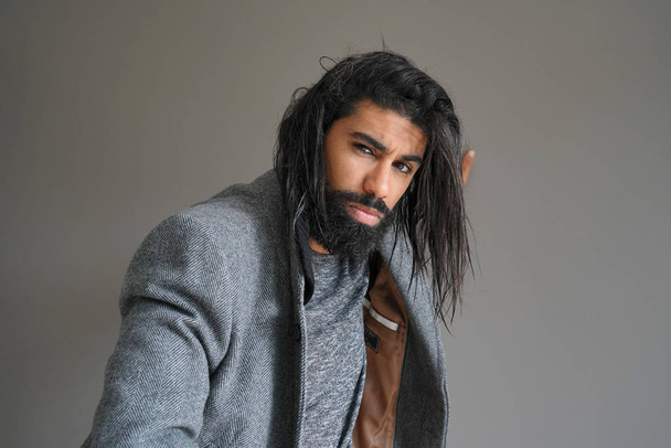 Hipster guy with grey coat, isolated - Photo, Image