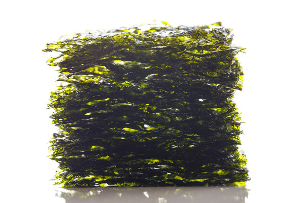 dried nori seaweed laminaria sheets, isolated on white - Photo, Image