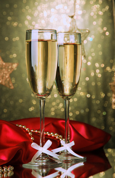 Two glasses of champagne on bright background with lights - Φωτογραφία, εικόνα
