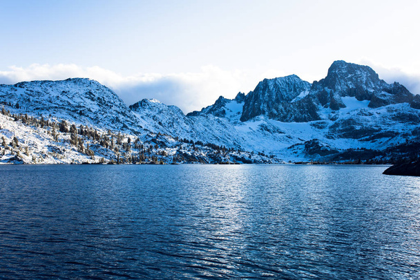Banner Peak over Garnet Lake in the Ansel Adams wilderness after a fresh snow - Photo, Image
