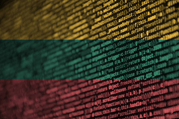 Lithuania flag  is depicted on the screen with the program code. The concept of modern technology and site development. - Photo, Image