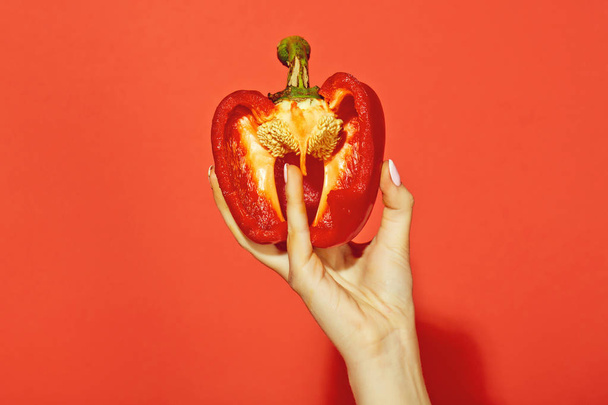 bell pepper in hand of woman hold sweet paprika, heart - Foto, afbeelding