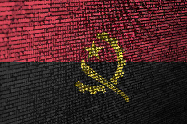 Angola flag  is depicted on the screen with the program code. The concept of modern technology and site development. - Photo, Image