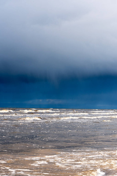 Dark sky with clouds over Baltic sea - Fotografie, Obrázek