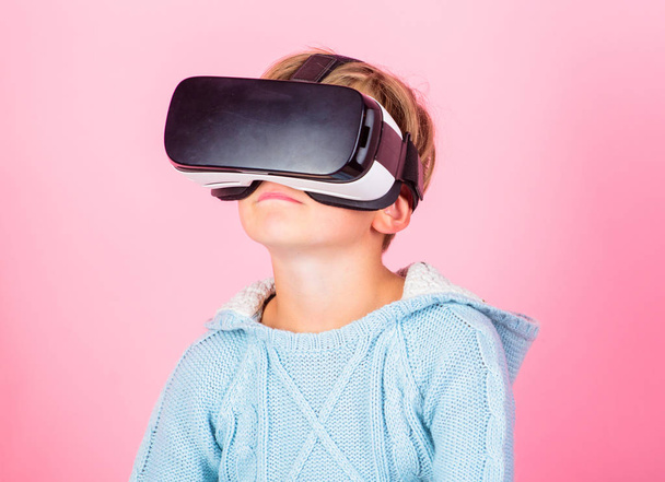 Discover virtual reality. Kid boy wear vr glasses pink background. Child boy play virtual reality game. Explore alternative reality. Cyber space and virtual gaming. Virtual reality future technology - Foto, Imagem