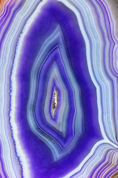 Amazing cross section of Violet Agate Crystal geode. Natural translucent agate crystal surface cut, Purple healing abstract structure slice mineral stone macro closeup - Photo, Image