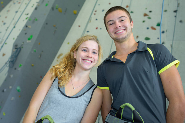 Portrait of young people in front of climbing wall - Фото, изображение