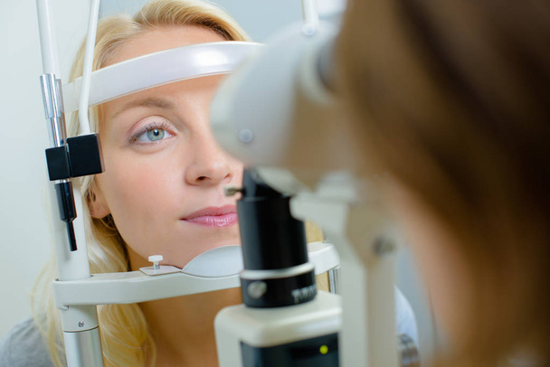 Closeup of lady having eye test - Photo, image