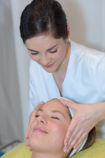 young woman getting spa treatment - 写真・画像