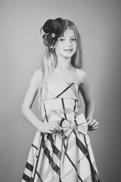 Pretty little girl in a dress and bow, fashion concept. smiling cute little girl - Fotografie, Obrázek
