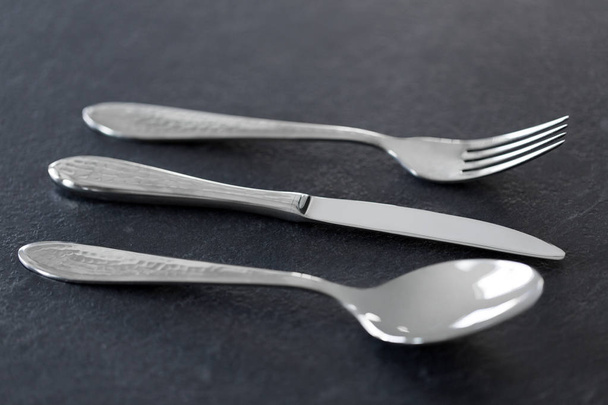 close up of fork, knife and spoon on table - Valokuva, kuva