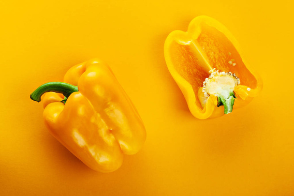 yellow bell peppers on a yellow background with space for text - Foto, Imagem