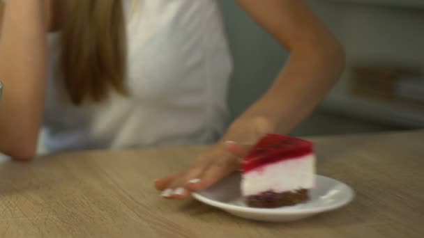 Fit woman eating salad instead of cake, choice of healthy lifestyle, close up - Filmmaterial, Video