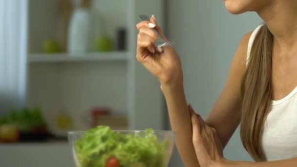 Pretty girl eats salad, refuses dessert, fit body and healthy nutrition, closeup - Video