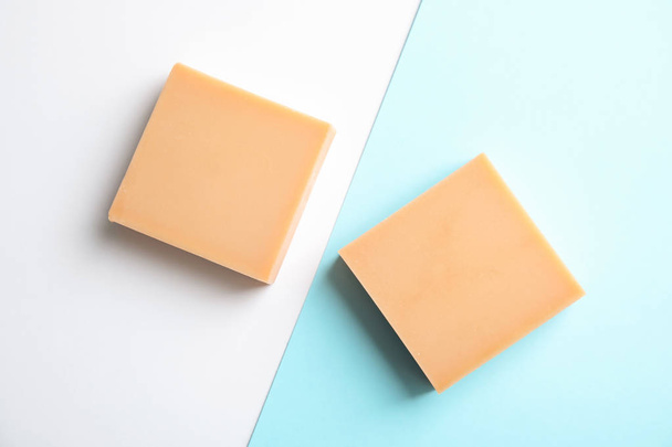 Hand made soap bars on color background, top view - Фото, изображение