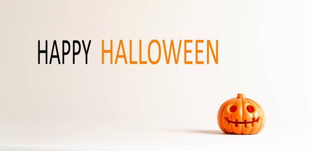 Happy Halloween message with a small pumpkin - Photo, image