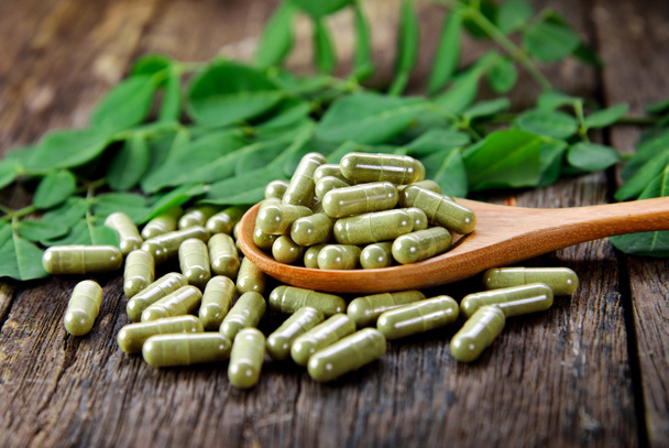 Moringa leaves and capsules (Herbs for health) - Photo, Image
