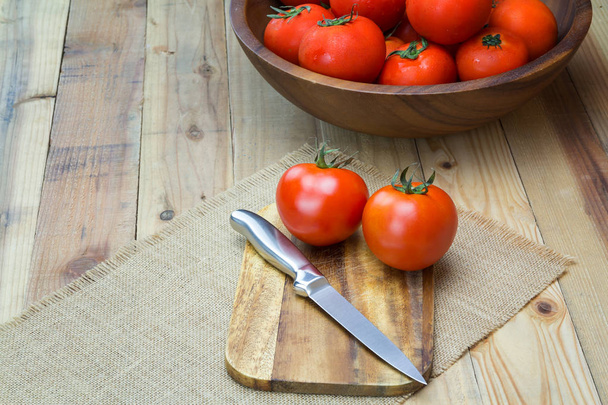 Closeup Fresh ripe tomatoes on wood background - Φωτογραφία, εικόνα