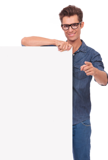happy man with panel, pointing - Foto, imagen