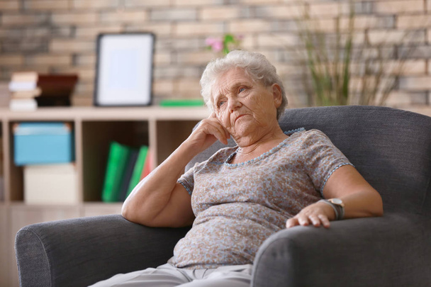 Depressed elderly woman at home - Фото, изображение