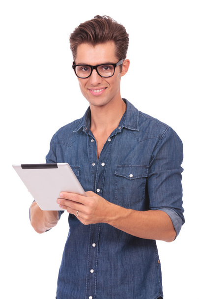 man with tablet smiles at you - Photo, Image