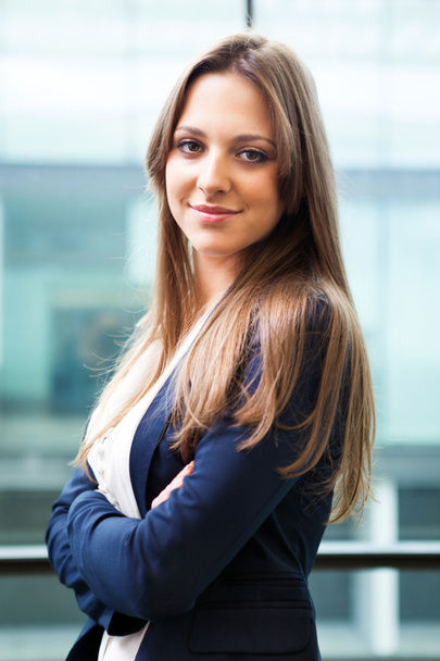 Portrait of cute young business woman smiling at the office - Foto, afbeelding