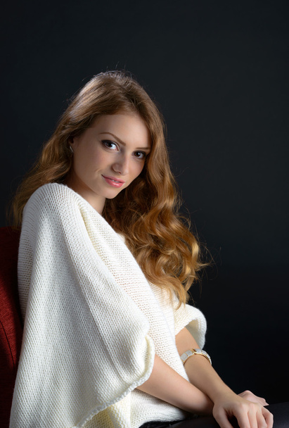 portrait of a beautiful blonde young woman in studio - Fotó, kép