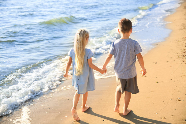 Cute little children on sea beach - Valokuva, kuva