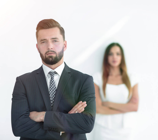 Portrait of a businessman with a woman in the background - Фото, зображення