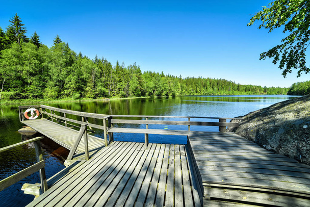 wooden bridge, lake and clear blue sky - Fotó, kép