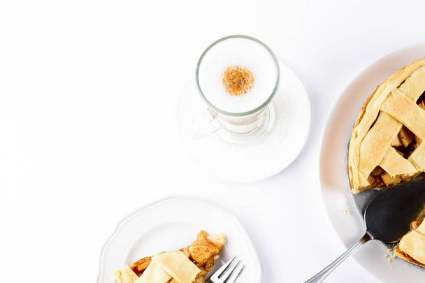 American apple pie with coffee Latte in glass Irish mug isolated on white background - 写真・画像