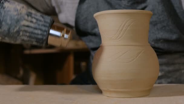 Potter drying ceramic pot with special dryer - Footage, Video