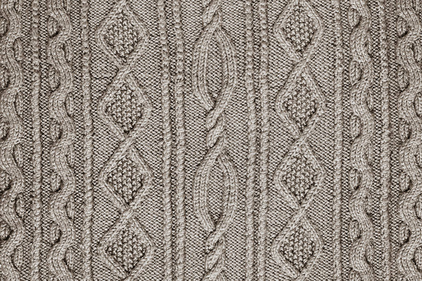 light beige background patterned knitted fabric closeup - Φωτογραφία, εικόνα