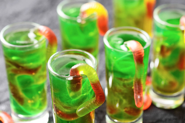 green Halloween jello shots with gummy worms - Photo, image