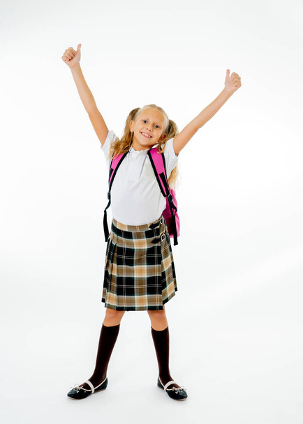 Adorable beautiful little schoolgirl with big pink schoolbag feeling excited and happy being back to school isolated on white background. Children education concept. - Photo, image