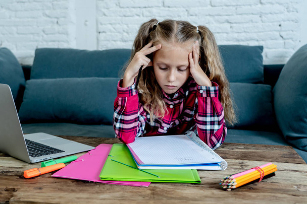 Beautiful cute blonde girl feeling sad and a overwhelmed trying to study at home. Learning difficulties exams homework and school education concept. - Valokuva, kuva