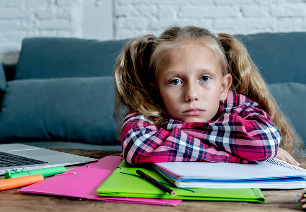 Beautiful cute blonde girl feeling sad and a overwhelmed trying to study at home. Learning difficulties exams homework and school education concept. - Foto, Bild
