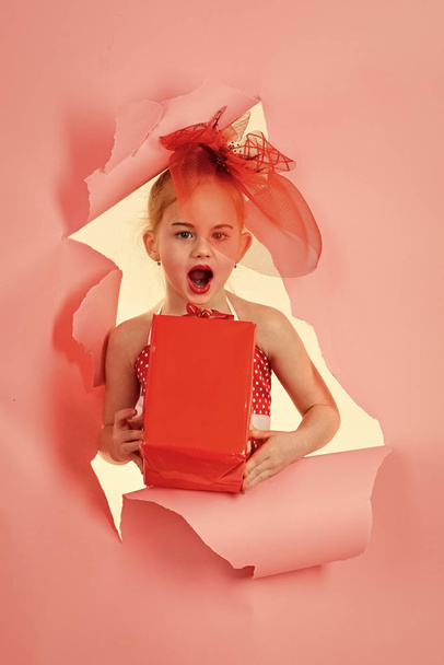 Child girl with present pack, cyber monday. Birthday and christmas. Small girl with shopping package, black friday. Childhood and happiness, gift box. Boxing day, holiday celebration and party. - Foto, Imagem